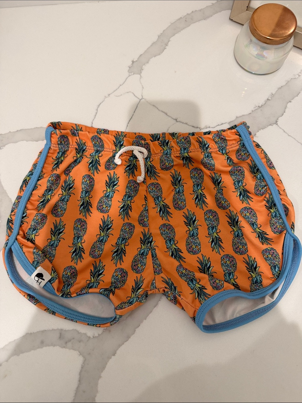 Kids Orange Pineapple Swim Trunks with Blue Trim